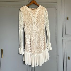 Short lace dress with nude underneath